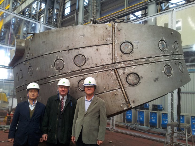 At Hyundai Heavy Industries, Alexander Alekseev, head of ITER's Tokamak Directorate (centre), stands with Technical Responsible Officers Hee-Jae Ahn (Korea, left) and Chang-Ho Choi (ITER Organization, right) in front of the upper segment of full-scale mockup for the ITER vacuum vessel. (Click to view larger version...)